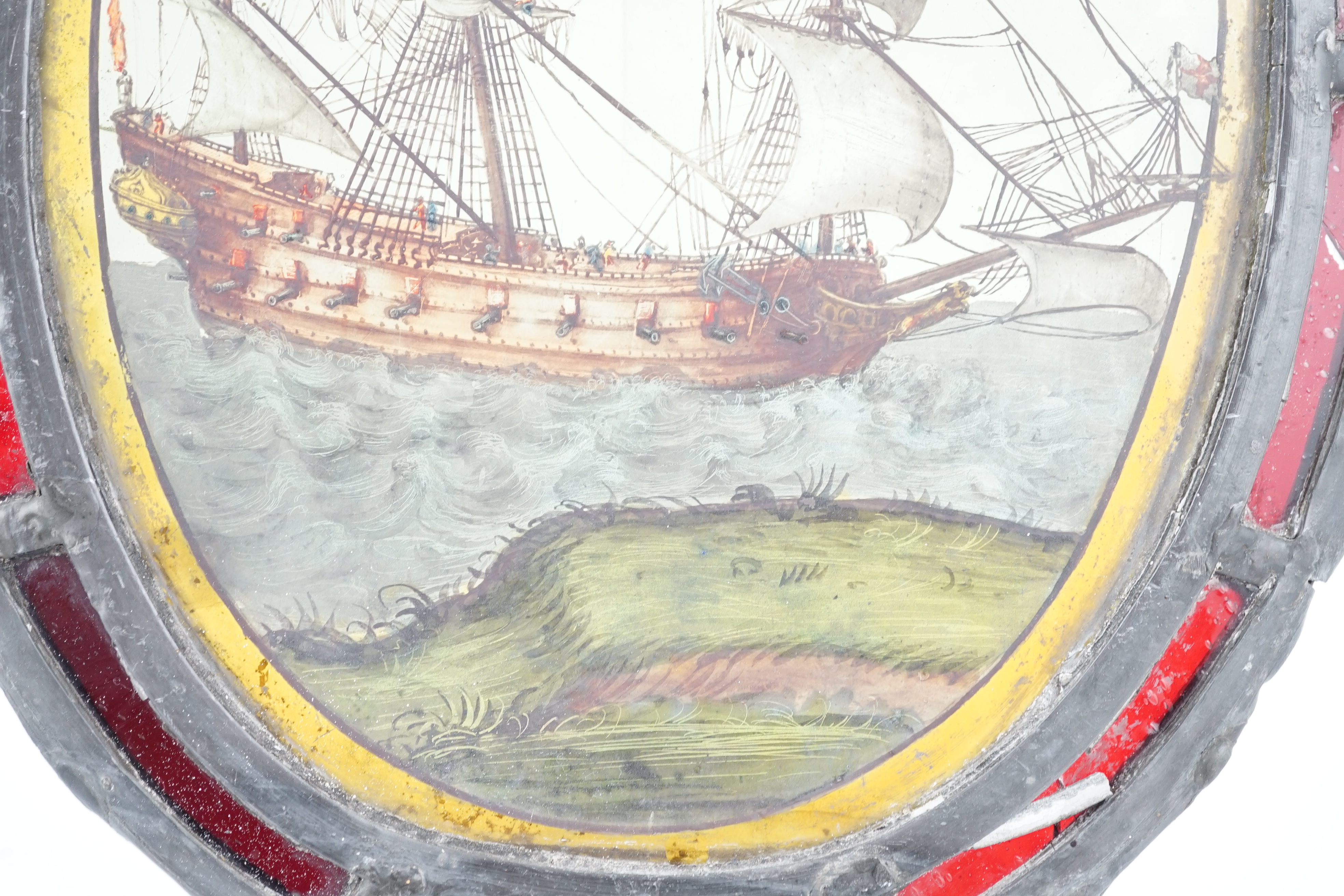 An early 18th century stained glass panel, overall 30 x 24cm